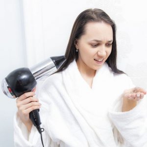 bigstock-young-woman-in-bathroom-with-h-364410892_1_621x621