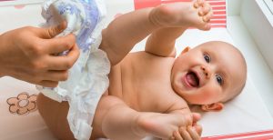bigstock-Mother-Changing-Diaper-To-Her-159926510-1170x600