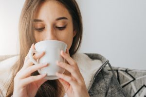 woman-sipping-coffee-in-the-morning-free-photo